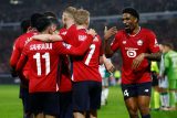 Hráči Lille slaví gól proti Feyenoordu