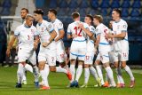 Fotbalisté se radují z branky do sítě Černé hory
