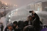 Turisté na zimním otevření stezky světel v Otaru