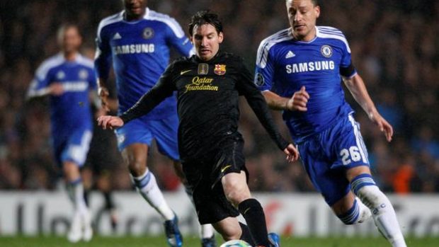 Lionel Messi (C) of Barcelona tries to evade John Terry (R) of Chelsea during their Champions League semi-final first leg at Stamford Bridge