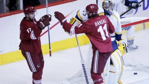 Phoenix Coyotes&#039; Radim Vrbata  (L) celebrates his goal with teammate Martin Hanzal (11) in front of Nashville Predators&#039; goalie Pekka Rinne and Roman Josi (R) during the first period of Game 1 of their NHL Western Conference semi-final hockey playoffs