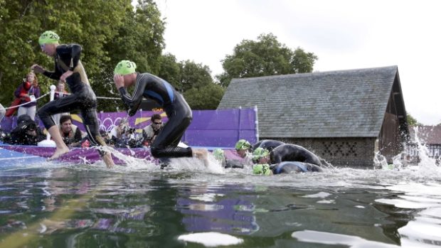 Lisa Norden (L) of Sweden  and Radka Vodičková of Czech Republic leave the water at the women&#039;s triathlon final during the London  2012 Olympic Games