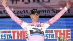 Ramunas Navardauskas of Lithuania celebrates on the podium as he wears the leader pink jersey after the team time trial 33.2-km fourth stage of the Giro d&#039;Italia in Verona May 9, 2012