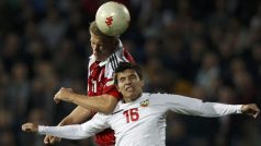 Bulgaria&#039;s Iliya Milanov (R) jumps for the ball with Denmark&#039;s Andreas Cornelius during their 2014 World Cup qualifying soccer match at Vassil Levski stadium in Sofia October 12, 2012