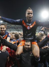 Montpellier&#039;s John Chukwudi Utaka reacts after becoming champions of the French Ligue 1 after defeating Auxerre at the Abbe Deschamps stadium in Auxerre, May 20, 2012