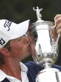 Webb Simpson of the U.S. kisses the the U.S. Open Championship Trophy after winning the 2012 U.S. Open golf tournament on the Lake Course at the Olympic Club in San Francisco, California June 17, 2012